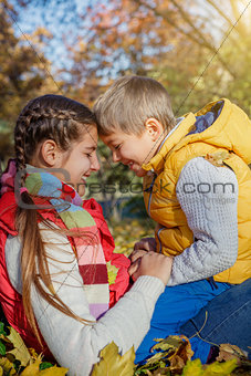 Kids having fun in autumn park