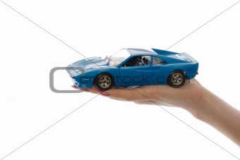 Car toy on palm