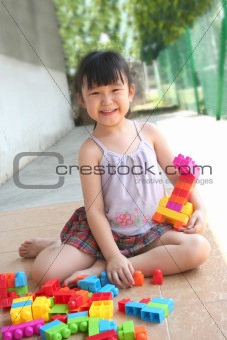 Girl playing blocks