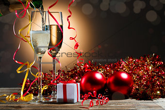Champagne fills the glasses and festive Christmas decorations