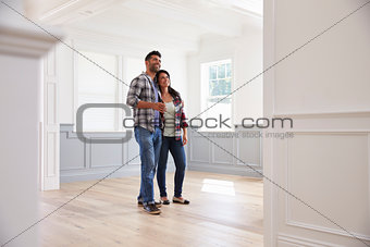 Hispanic Couple Viewing Potential New Home