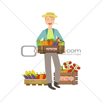 Guy Holding A Wooden Crate Full Of Fresh Vegetables