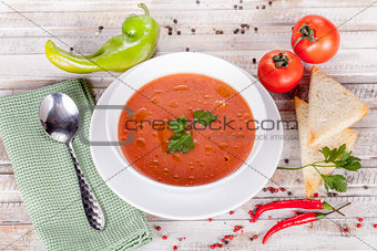 Tomato soup on white table