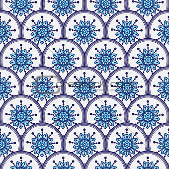 Seamless pattern of circles with blue flowers 