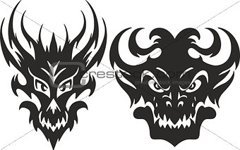 Symmetrical monster head tattoos