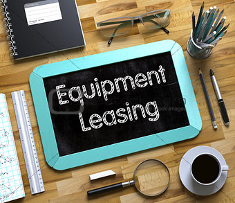 Equipment Leasing - Text on Small Chalkboard. 3D.