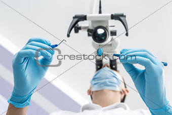 Using a dental microscope