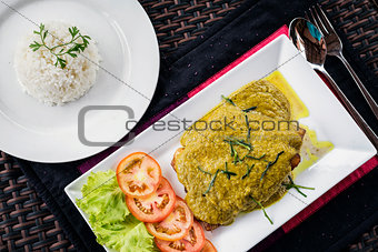 thai fish fillet with asian green curry sauce meal