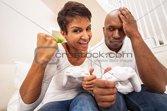 African American Couple Having Fun Playing Video Console Game