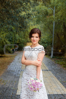 Bride in the park in the alley