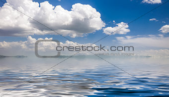 sea and cloudy blue sky