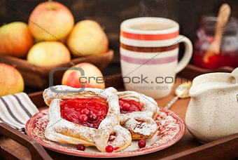 Delicious berry puff pastry with powdered sugar and coffee