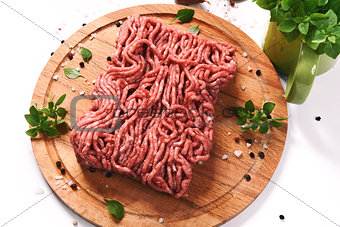 minced meat on a wooden cutting board