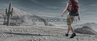 Tourist backpacking through desert. 