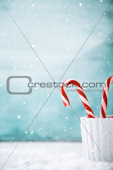 Candy cane on snow