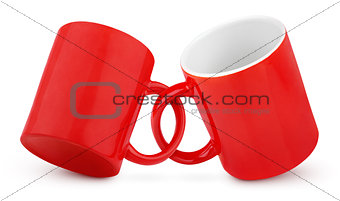 Two coupled red mugs