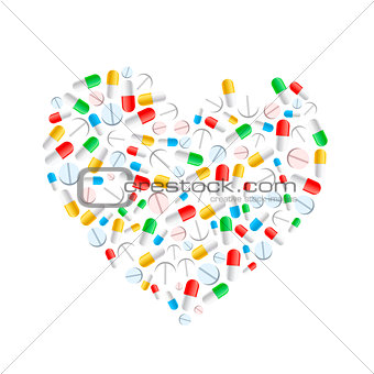 Colourful pills in heart shape isolated on white
