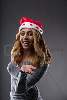 afro-american woman with Santa's Hat just sent a kiss