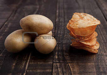 Fresh potatoes and crisps healthy and junk food