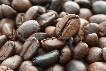 Heap of roasted brown coffee beans 