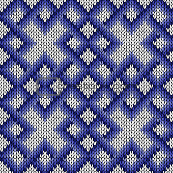 Knitting ornate seamless pattern in blue and white colors