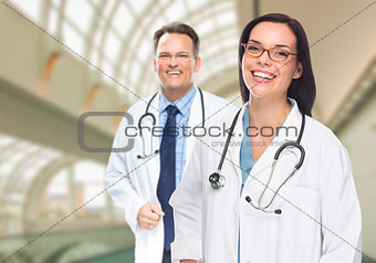 Two Doctors or Nurses Inside Hospital Building