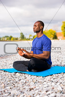 young man exercising yoga
