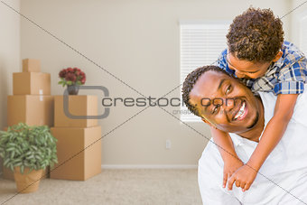 Mixed Race African American Father and Son In Room with Packed M