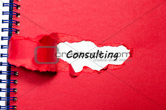 The word consulting appearing behind torn paper