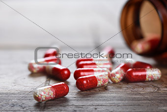 Heap of red capsule pills. Pharmacy theme