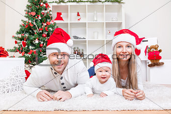 Happy family celebrating Christmas at home