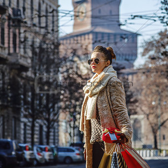 tourist woman in Milan looking into the distance and walking