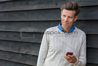 Happy Middle Aged Man Using Mobile Cell Phone