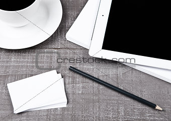 Graphic tablet with pencil paper cards and coffee