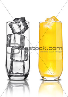 Glass of orange soda with ice cubes empty glass