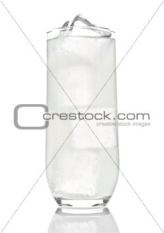 Glass of lemon lemonade with ice cubes and bubbles