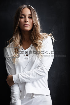 Woman in white sportsuit