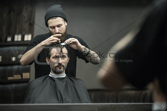 Preparing for haircut in barbershop