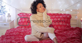 Young woman celebrating alone at Christmas