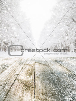 Wooden table in winter forest