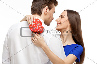 Happy young couple with Valentine's Day present