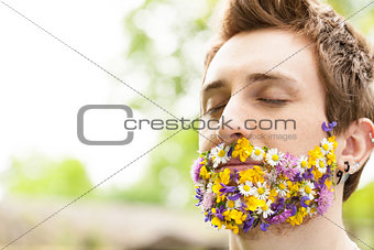 portrait of a guy with flowers instead of his beard