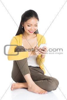 Young Asian girl using smartphone