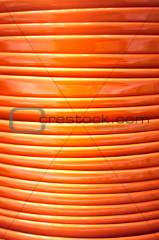 Stack of orange plates close-up