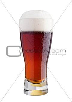 Glass of brown ale beer with foam isolated