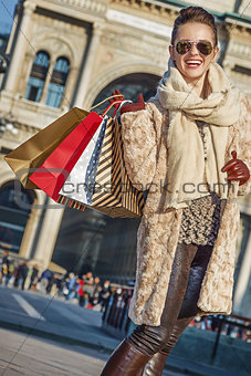 happy tourist woman at Piazza del Duomo in Milan, Italy standing