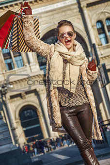 happy woman at Piazza del Duomo in Milan, Italy rejoicing