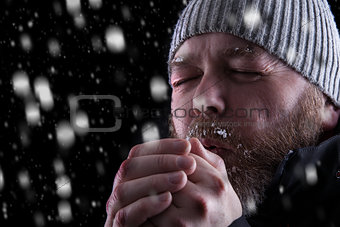 Freezing cold man in snow storm