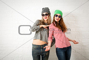 Two Smiling Fashion Hipster Girls in Spring