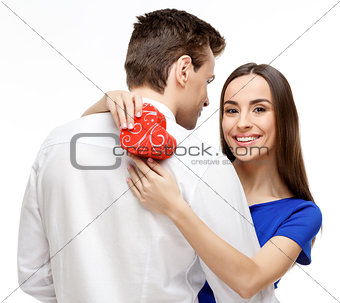Happy young couple with Valentine's Day present